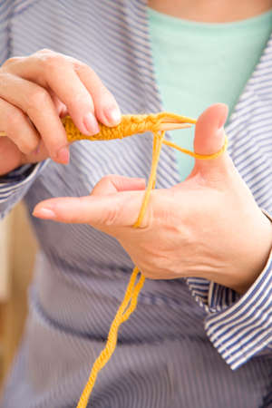 Hand of the woman to the knittingの写真素材