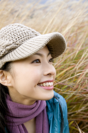 Women stand in the field of pampas grassの写真素材