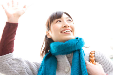 Woman to stop a taxiの写真素材