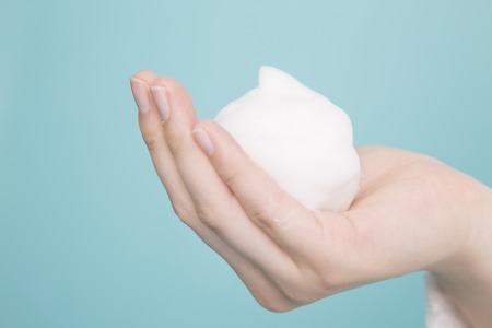 Women put the foam on handの写真素材