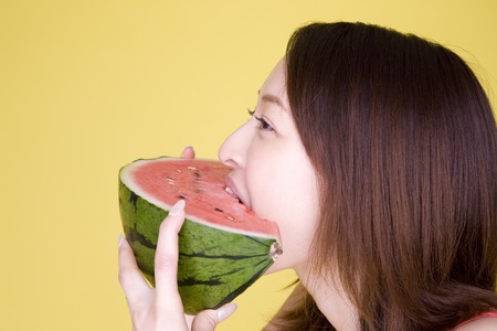 Women who eat a watermelonの写真素材