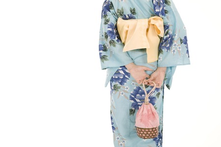 Rear View of yukata woman with a drawstring bagの写真素材