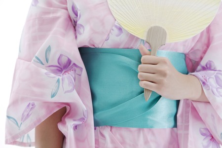 Hand of yukata woman with a fanの写真素材