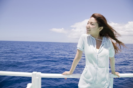 Woman on the ferry offers viewsの写真素材