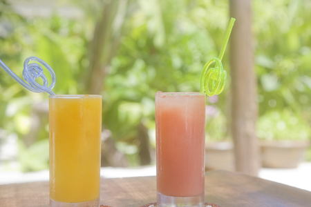 Orange juice and pink grapefruit juiceの写真素材