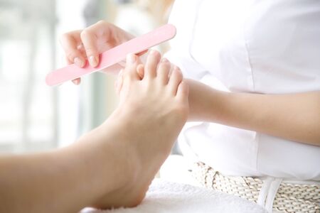 Woman to clean the toenailsの写真素材