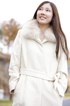 Woman wearing a coatの写真素材