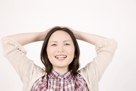 Women who are put on both hands the headの写真素材