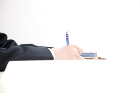 Hand of the men's junior high school students to study in the Schoolの写真素材