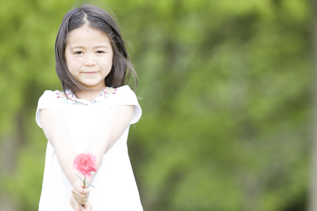 Girl with a flowerの写真素材
