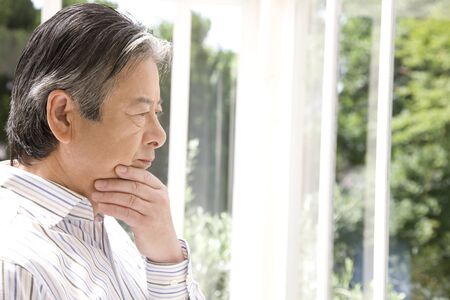 Senior men who lost in thoughtの写真素材