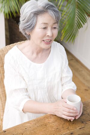 Senior woman drinking teaの写真素材
