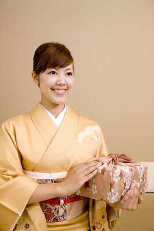Woman with a furoshiki wrappingの写真素材