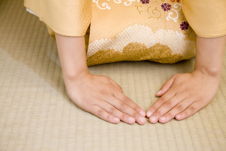 Hand of women take both hands to foldの写真素材