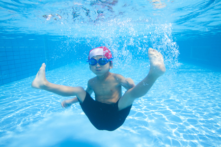 Boy swimsuit that dive into the waterの写真素材