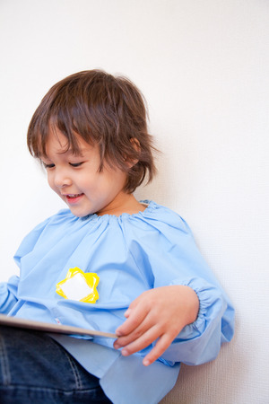 Read picture books kindergarten boysの写真素材