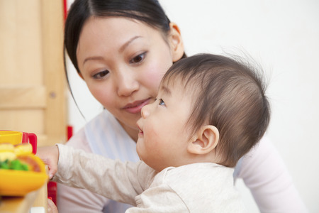 Nursery and preschool boys playing with toysの写真素材