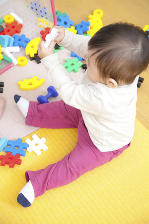 Nursery garden boys play with toysの写真素材