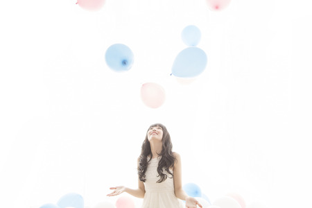 Girls playing with balloonsの写真素材