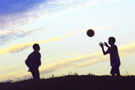 Boys playing with ballの写真素材