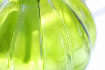 glass bottles of green light is passing throughの写真素材