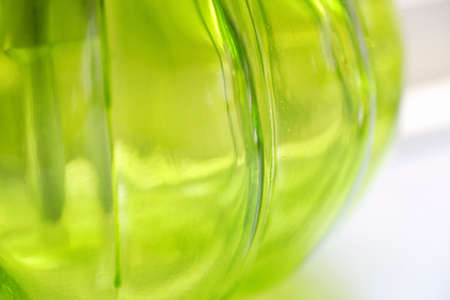 glass bottles of green light is passing throughの写真素材