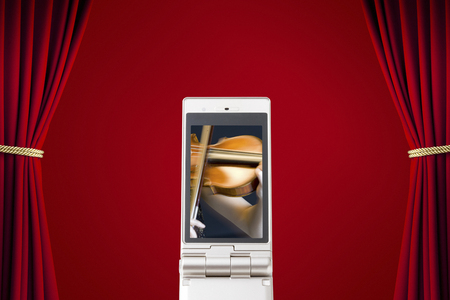Woman playing the violin, which moves to the mobile screenの写真素材