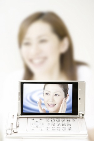 On the mobile screen Este soonの写真素材