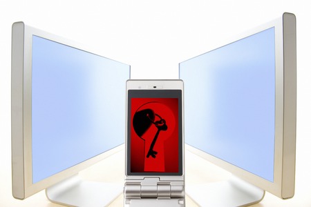 Key on the mobile screen and Keyhole and PCの写真素材