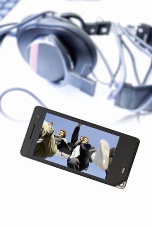 Youth and music equipment that moves to the mobile screenの写真素材