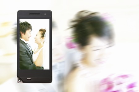 Bride and groom on the mobile screen