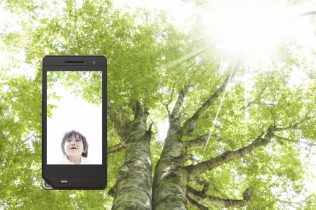 Baby and is surrounded by green smile that moves to the mobile screen