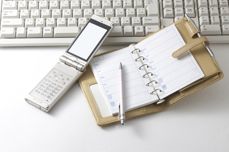Mobile phone and notebookの写真素材