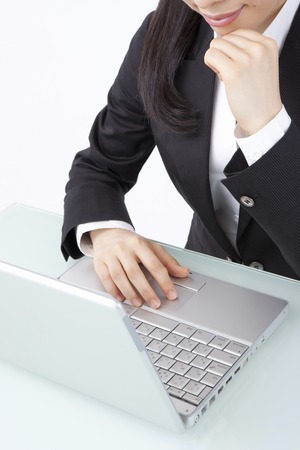 OL to work on a laptop computerの写真素材