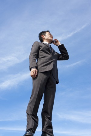 Businessman talking on mobile phoneの写真素材