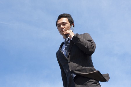 Businessman talking on mobile phoneの写真素材