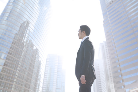 Businessman standing in downtownの写真素材