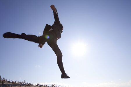 Businessman jumping