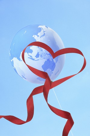 Heart ribbon and world map balloonの写真素材