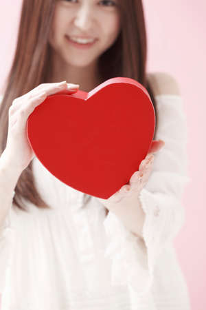 Women with heart packageの写真素材
