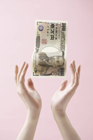 Hand and moneyの写真素材