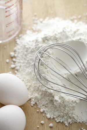 Flour and eggs and whisk