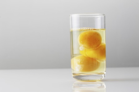 Cups and raw eggの写真素材