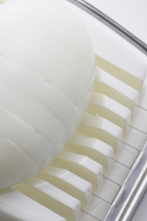 Egg cutter and boiled eggの写真素材