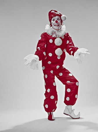 Red clown to be acting in a white Horizontの写真素材