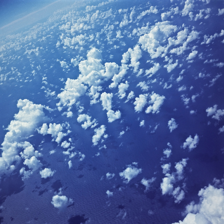 Pacific Ocean and clouds as seen from the window of the passenger planeの写真素材
