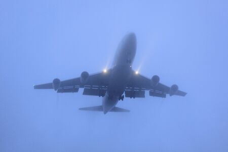 Airliner to land in the fogの写真素材