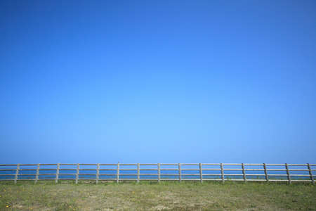 The sea and the fence and the skyの写真素材