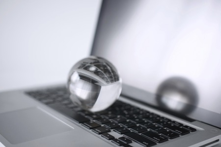 Crystal ball and a personal computerの写真素材