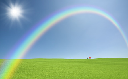 Red roof of the Prairie and cloud and Rainbow and the Sunの写真素材